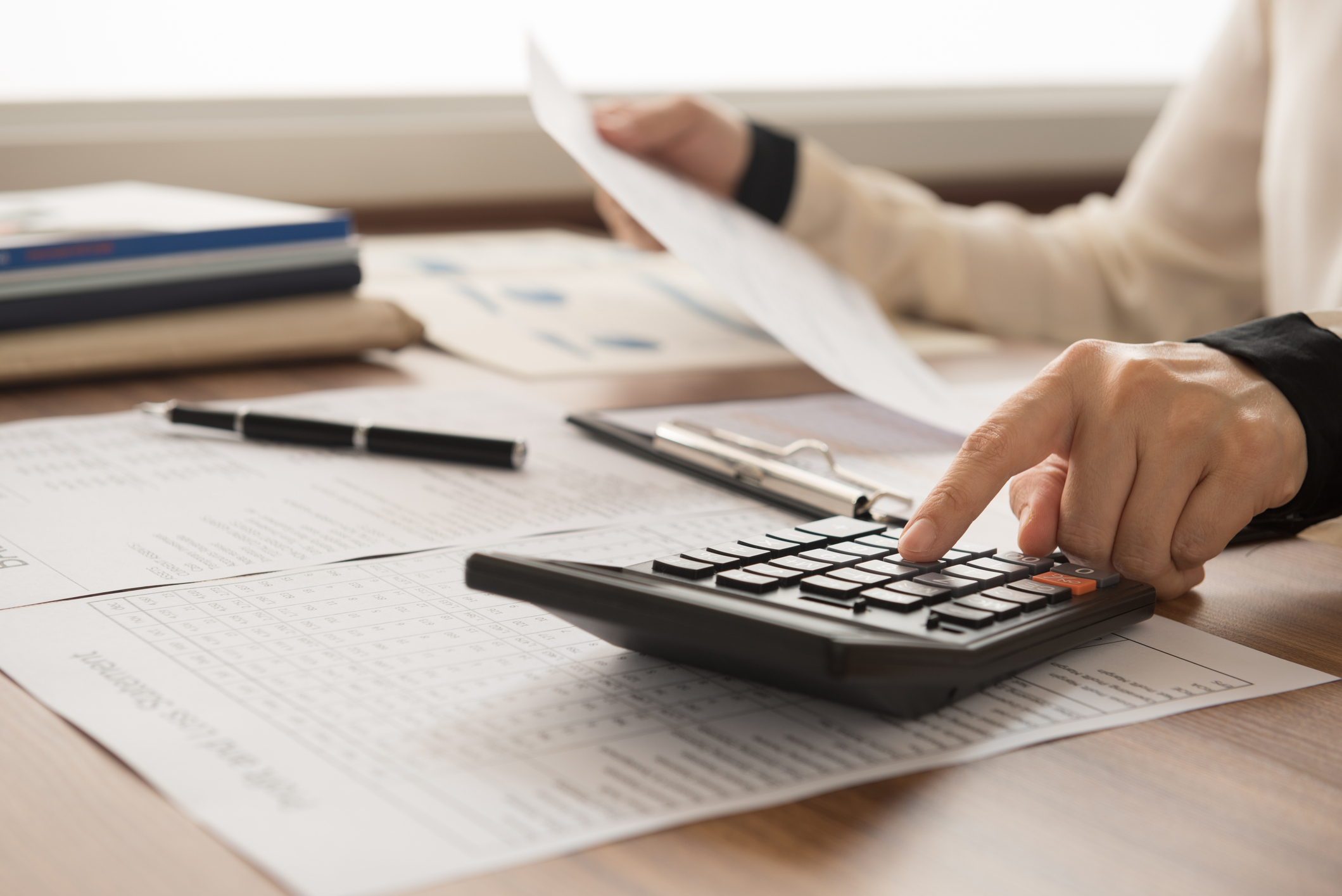 Archer Lewis accountant conducting a financial statement review for a business client
