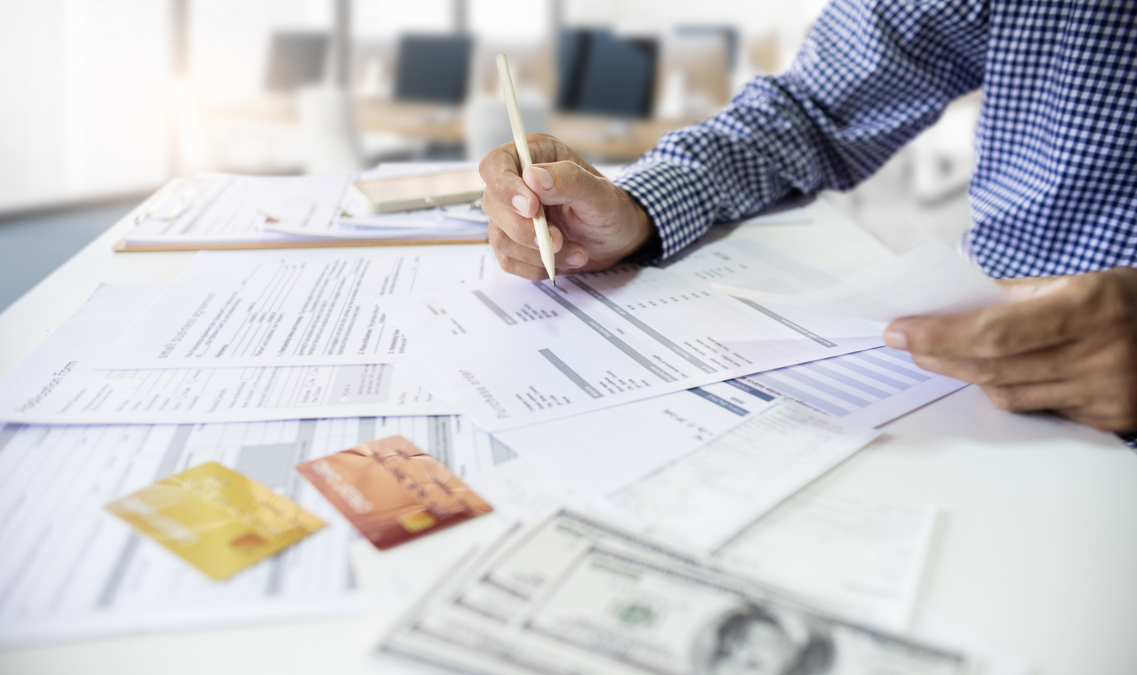 An Archer Lewis accountant reviewing financials with a business owner