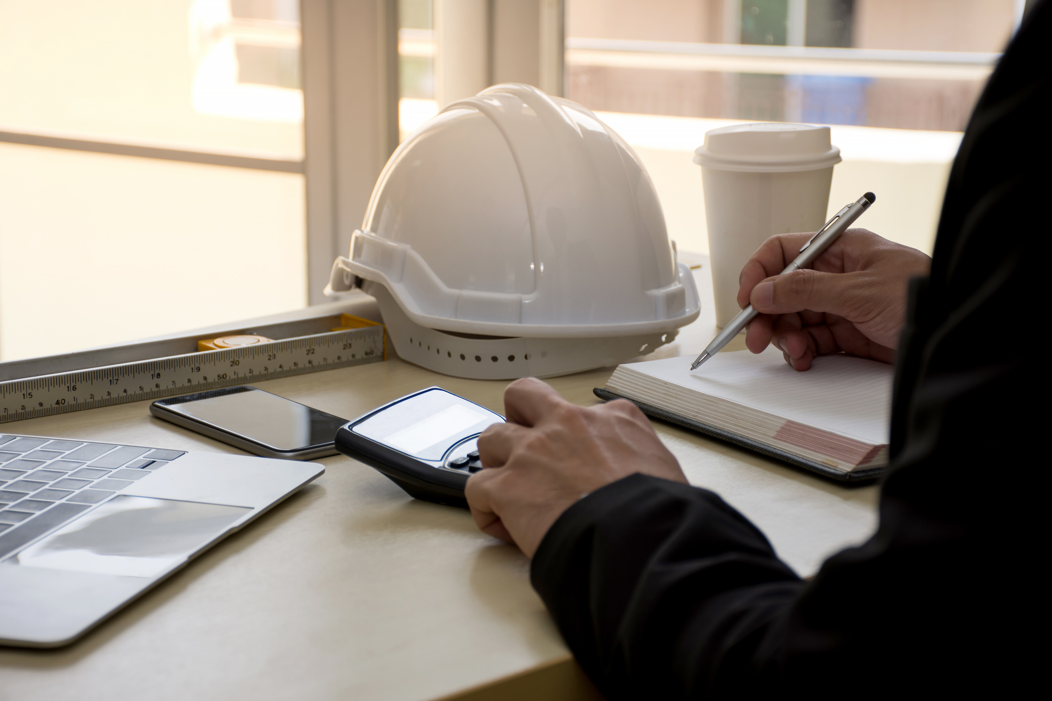 Archer Lewis advisor working with a construction contractor on job costing and tax planning