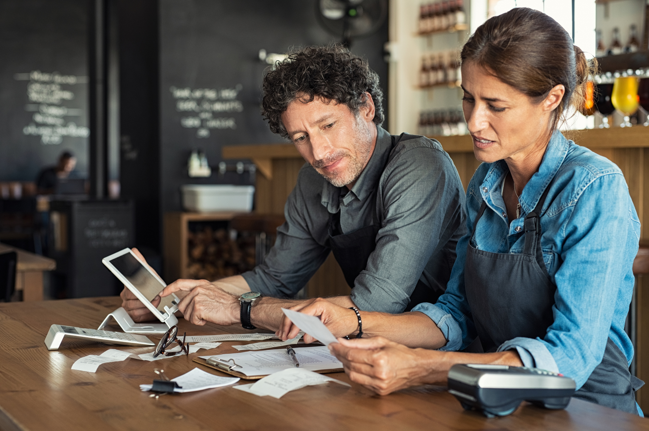Archer Lewis advisor working with a restaurant owner on financial planning and tax strategy