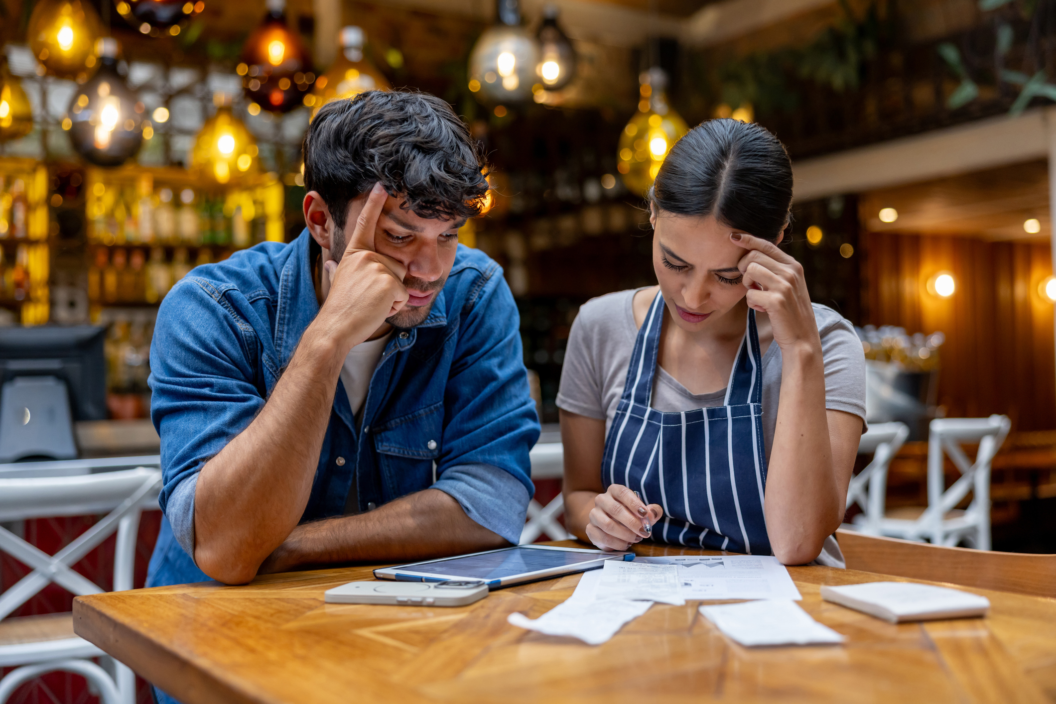 Archer Lewis advisor working with a small business owner on financial planning